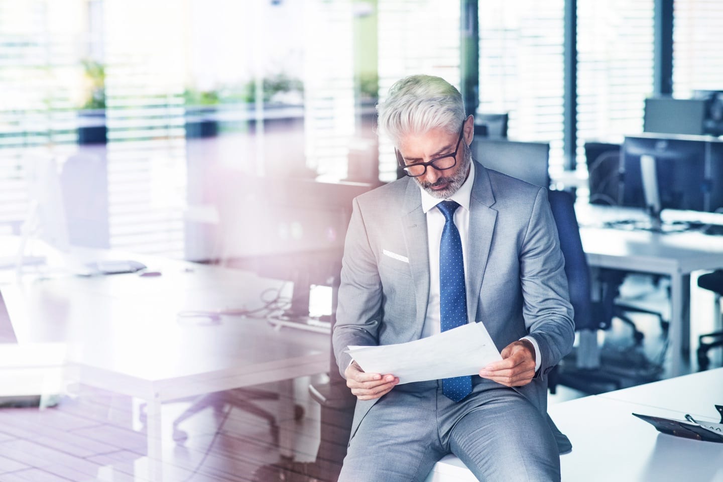 mature businessman in gray suit in the office