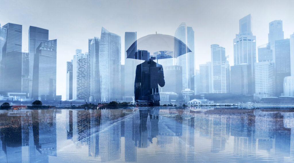 insurance-concept-risk-in-business-businessman-with-umbrella