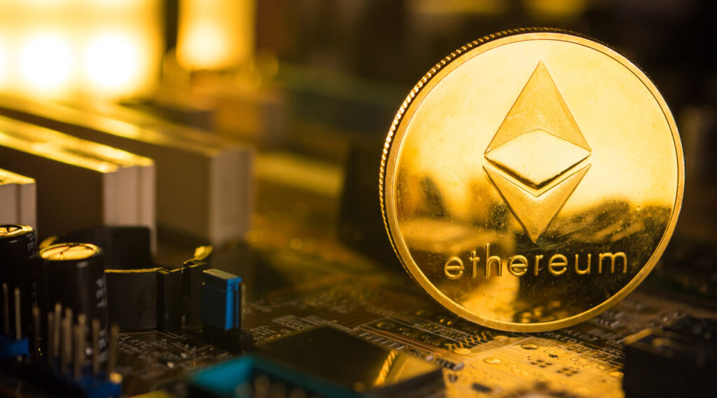 a-golden-coin-with-ethereum-symbol-on-a-mainboard
